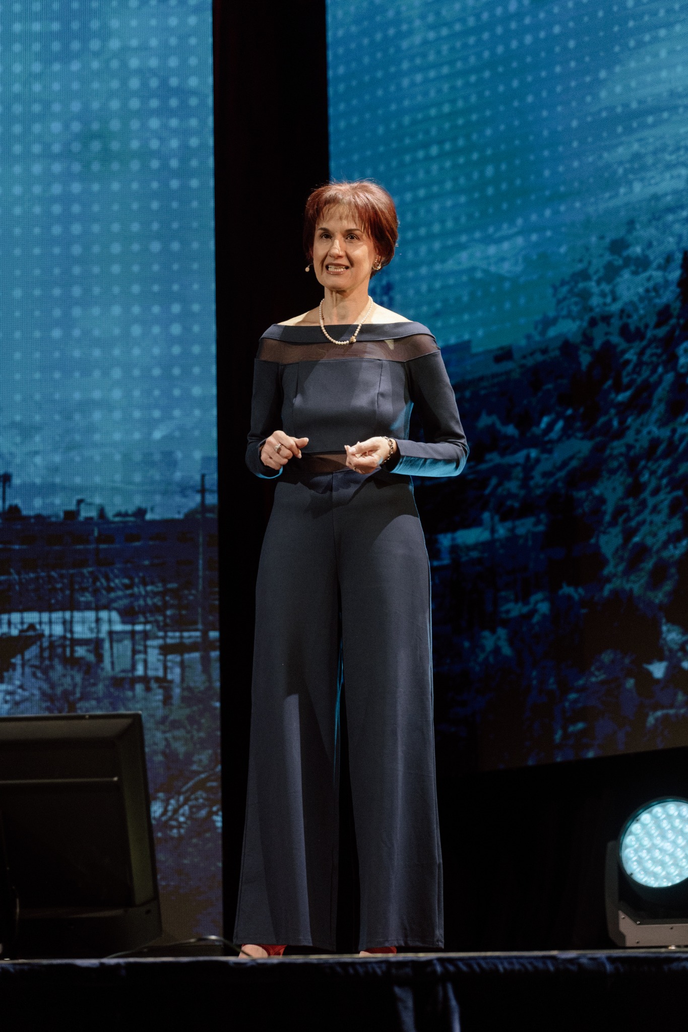 Alina Trigub presenting on stage